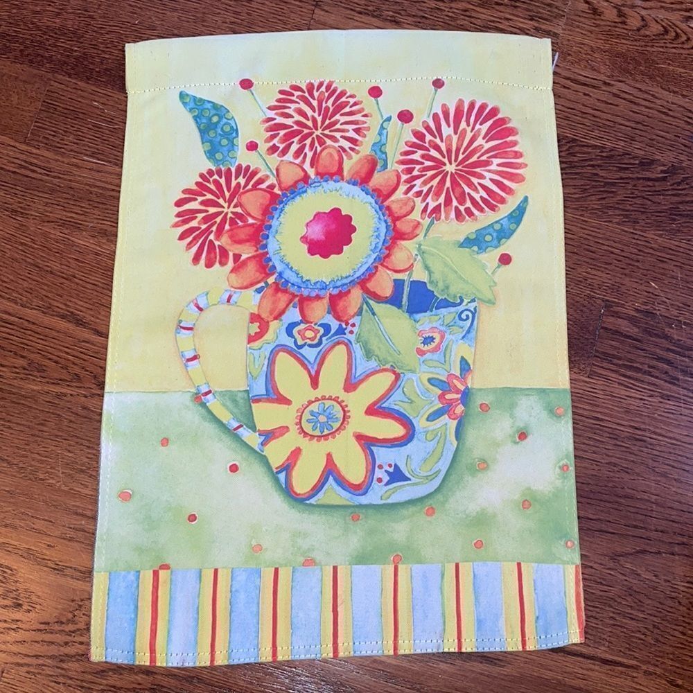 Multi colored flowers in a‎ cup garden flag